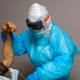 A healthcare worker helps move a patient in the covid-19 ward at United Memorial Medical Center in Houston, Texas on December 4, 2020.